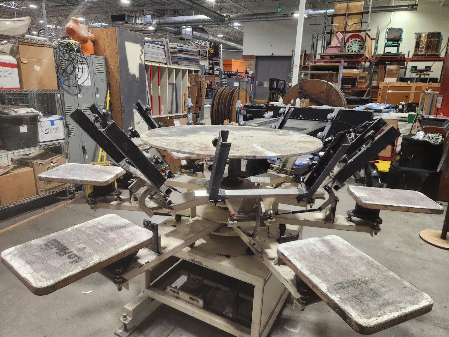 Multi-station screen printing press inside The Generator workshop in Reno